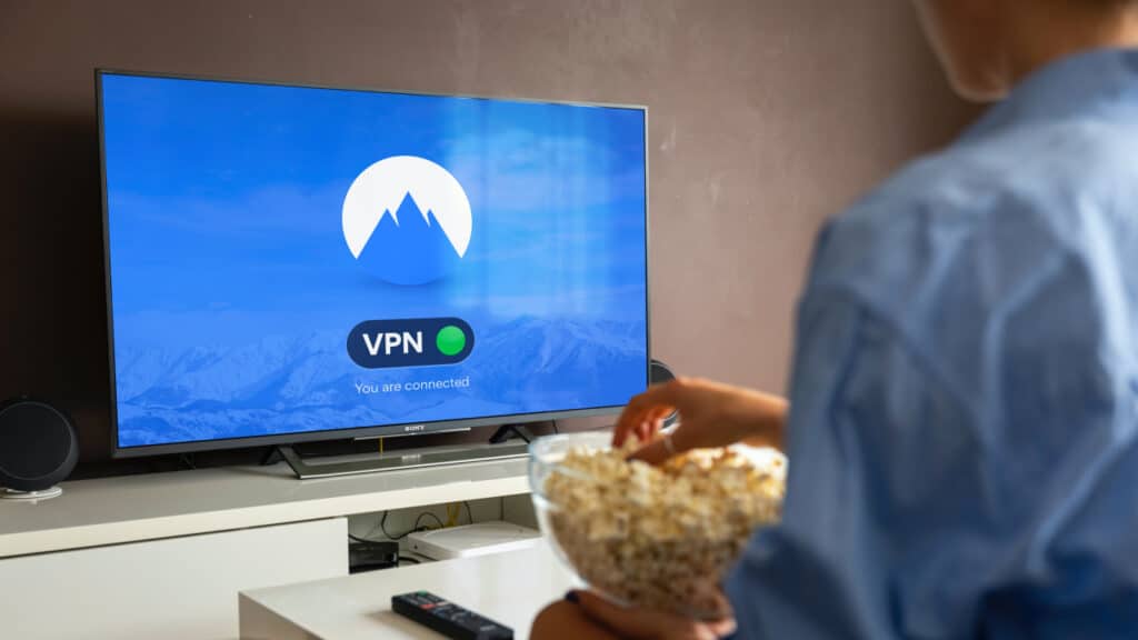 VPN for streaming services. Image of VPN connecting on a TV screen.