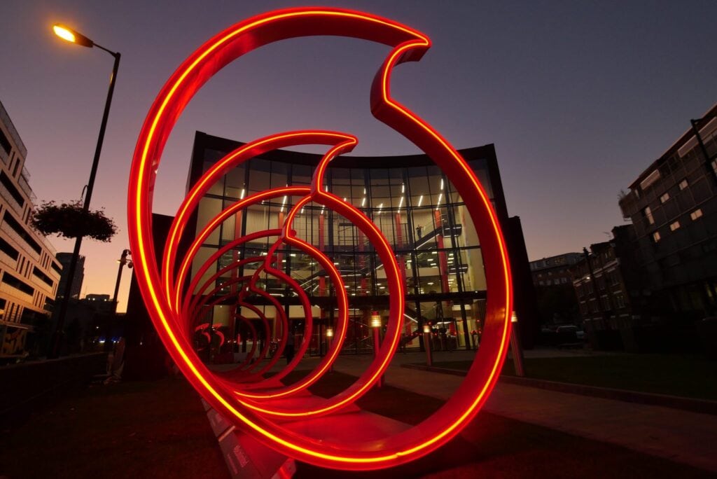 Vodafone logo in neon outside headquarters