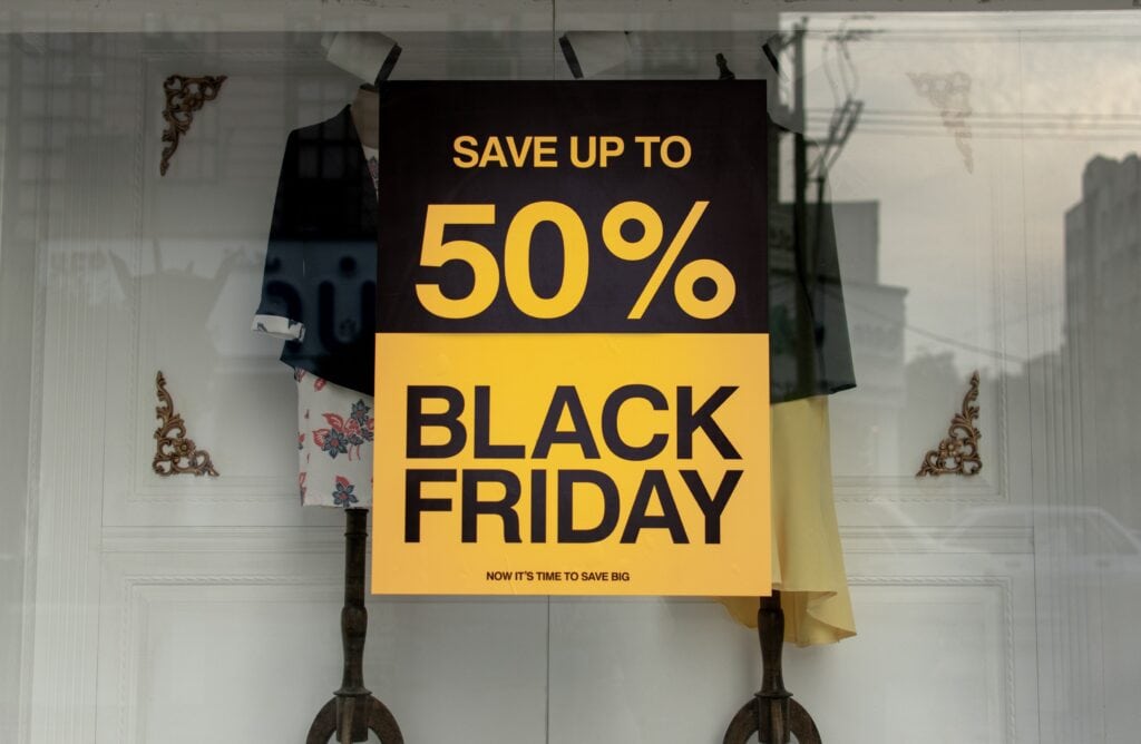 Shop window with Black Friday banner offering 50% off