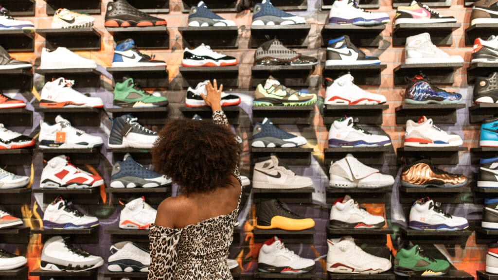 woman shopping for trainers
